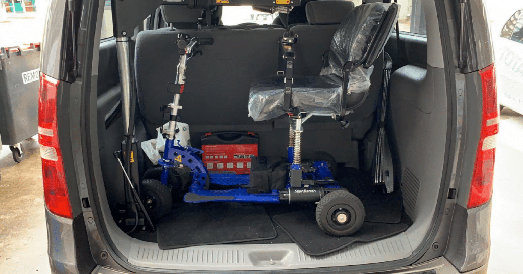 Blue scooter attached to an SG50 hoist inside an Imax boot