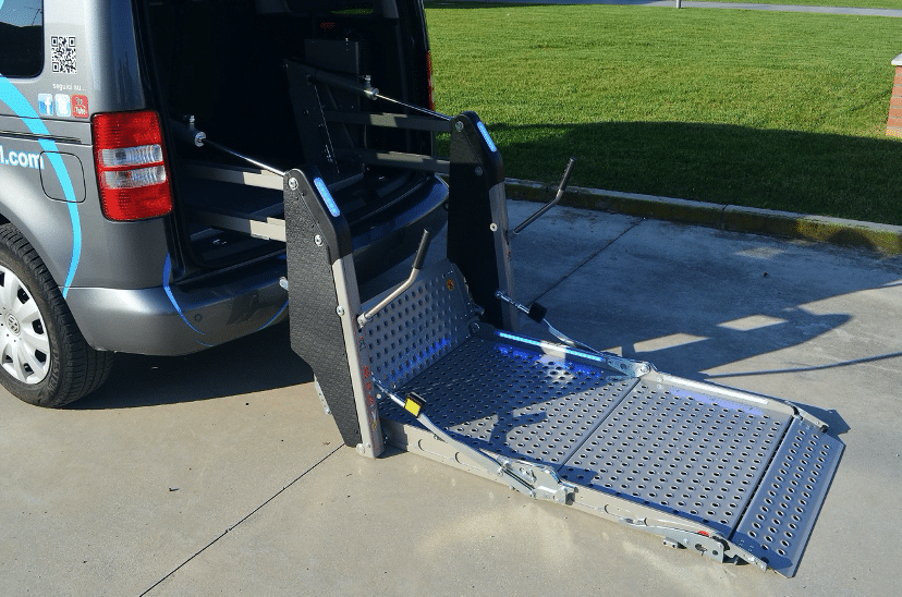 Platform lift down to the ground at the back of a van
