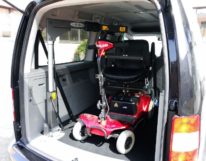 SG50 hoist with red scooter in boot of van