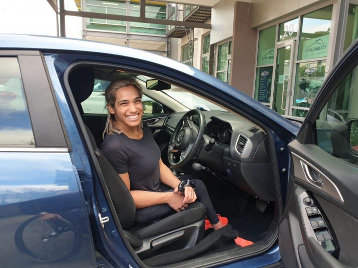 Madi De Rozario in driver seat with satellite accelerator from total Ability