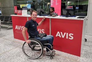 Total Ability's Paul Crake at the Avis Car Rental Counter