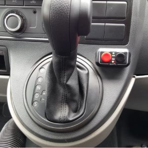 Image of car gear stick with Fadiel Hand Brake buttons, red and black, to the right