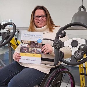 Michelina Pelosi with the 2025 Edition of the Complete Guide to Driving With Disability